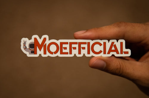 hand holding a sticker with the word Moefficial 